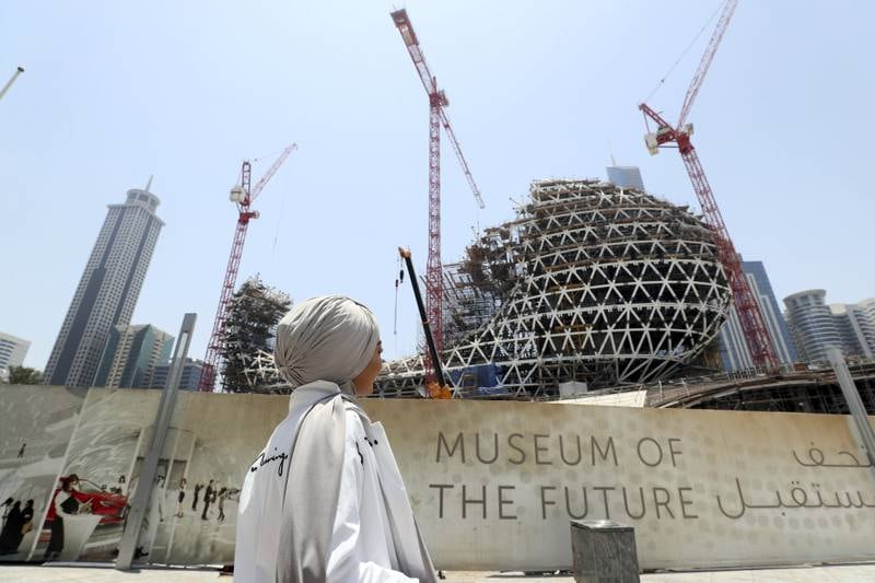 Dubai, United Arab Emirates - June 26th, 2018: Standalone. A women looks at the construction of the Museum of the Future. Tuesday, June 26th, 2018 in Downtown, Dubai. Chris Whiteoak / The National