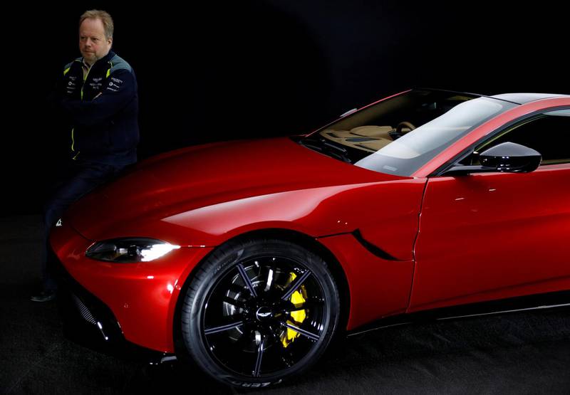 FILE PHOTO: Andy Palmer, CEO of Aston Martin, poses for a photograph next to the company's new Vantage car in Gaydon, Britain November 20, 2017. REUTERS/Phil Noble/File Photo