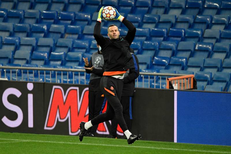Inter Milan goalkeeper Samir Handanovic jumps for the ball during a training session in Madrid. AFP