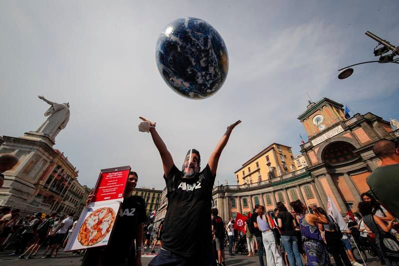 People demonstrate on the sidelines of a meeting of environment ministers in Naples, Italy. AP