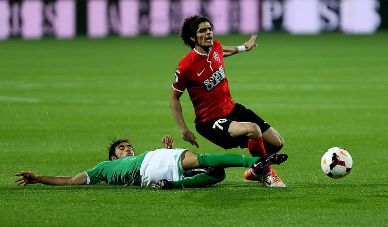 Dubai, United Arab Emirates- March,03, 2014: (L) Naseer Masood of Al Shabab and (R)  Waleed Hussain of Al Ahli in action duirng the AGL match at the Rashid Stadium  in Dubai . ( Satish Kumar / The National )  For Sports