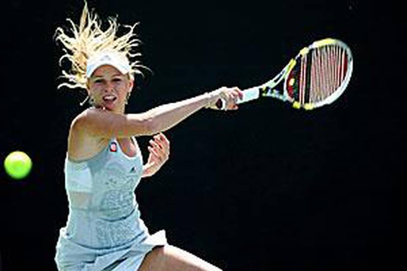 Caroline Wozniacki of Denmark returns to Israel's Shahar Peer during their third round match.