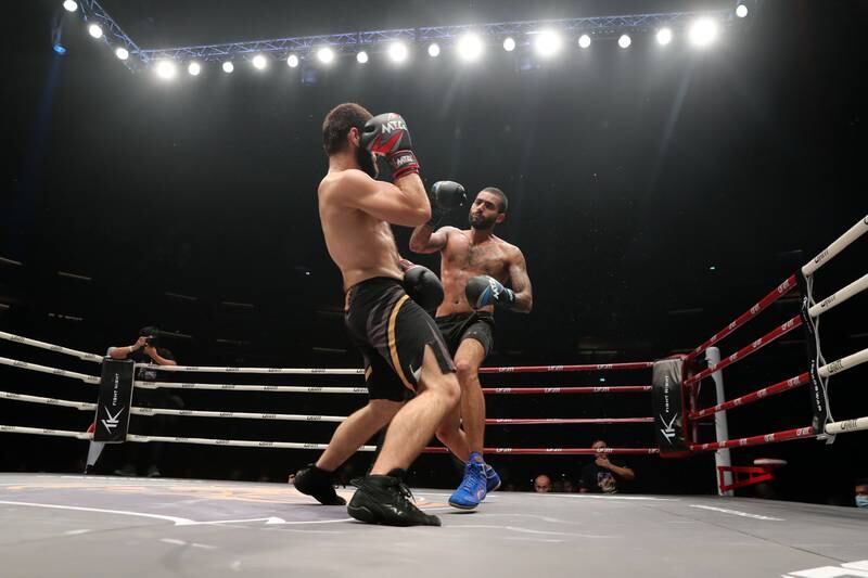 King Anobis (blue gloves) takes on Hamza Yamadaev (red gloves) at the Social Knockout at the Coca-Cola Arena in Dubai.