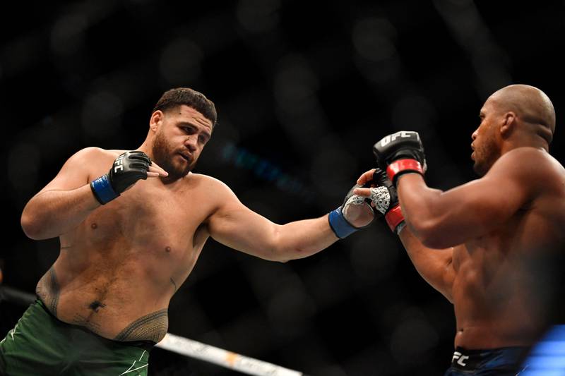 Ciryl Gane parries a punch from Tai Tuivasa during their heavyweight fight at the UFC event in Paris. AFP