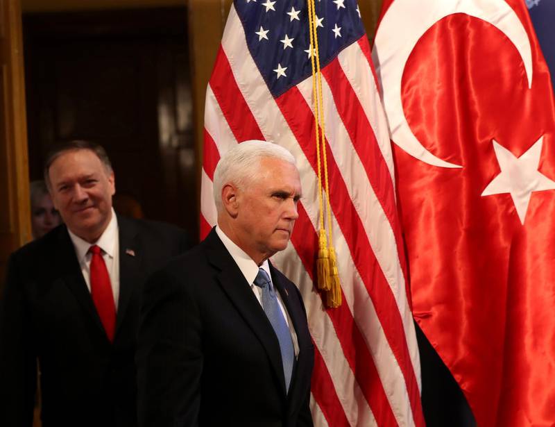 US Vice President Mike Pence (R) and US Secretary of State Mike Pompeo (L) arrive to attend a press conference at the U.S. Embassy in Ankara, Turkey, October 17, 2019.  / AFP / Adem ALTAN
