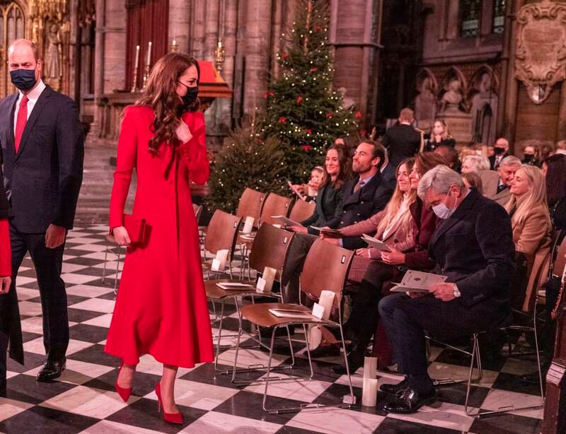 With her siblings Pippa and James, and parents Carole and Michael at the 'Together at Christmas' community carol service on December 8, 2021. Getty Images