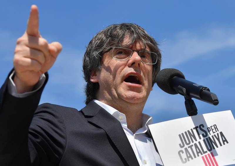 Former Catalan premier Carles Puigdemont addresses a press conference in front of the European Commission headquarters in Brussels on May 24, 2019. - Puigdemont will be the lead candidate for "Junts per Catalunya" party (Together For Catalonia) in the May 26 European parliament elections. (Photo by EMMANUEL DUNAND / AFP)