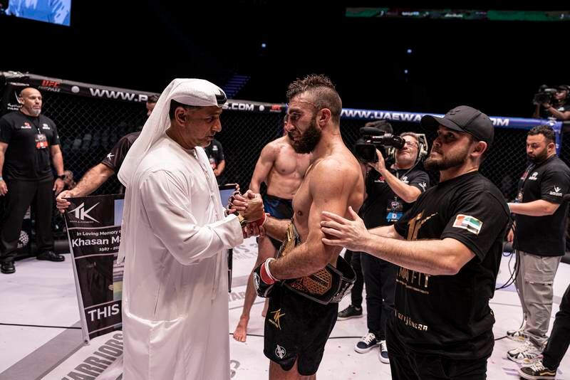 Abdulmunam Al Hashemi, chairman of Palms Sports, with Mohammad Yahya, after presenting the belt.