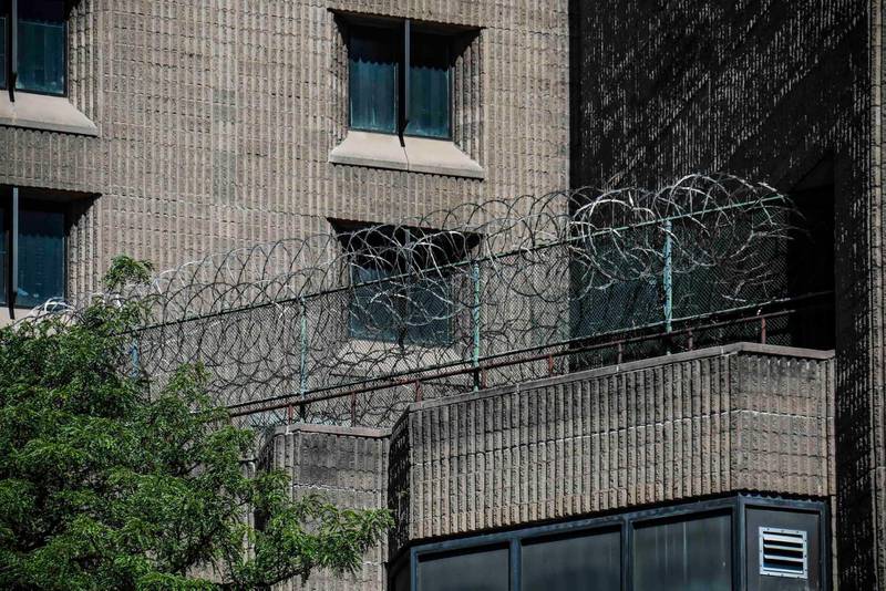 This photo from Saturday Aug. 10, 2019, shows razor wire fencing at the Metropolitan Correctional Center in New York where financier Jeffrey Epstein died while awaiting trial on sex-trafficking charges. (A P Photo/Bebeto Matthews)