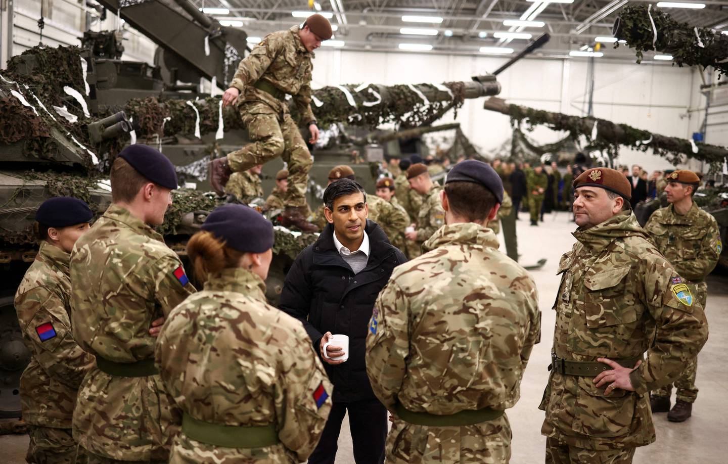 British Prime Minister Rishi Sunak talks with Nato Troops at the Tapa Military base, in Tapa, Estonia on December 19. AFP