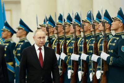 Russia's President Vladimir Putin inspects a guard of honour during a welcoming ceremony in Astana, Kazakhstan. AFP