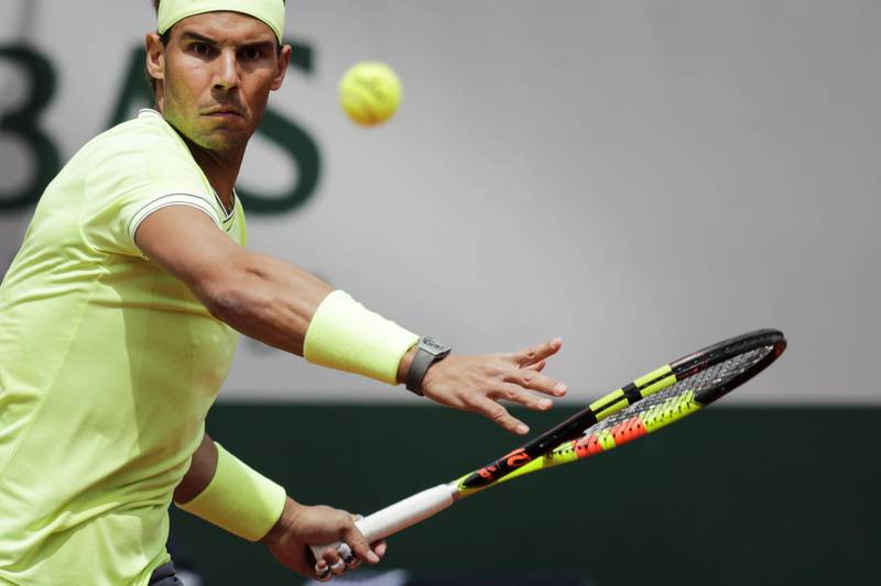 TOPSHOT - Spain's Rafael Nadal eyes the ball before playing a forehand return Germany's Yannick Hanfmann during their men's singles first round match on day two of The Roland Garros 2019 French Open tennis tournament in Paris on May 27, 2019. / AFP / Thomas SAMSON
