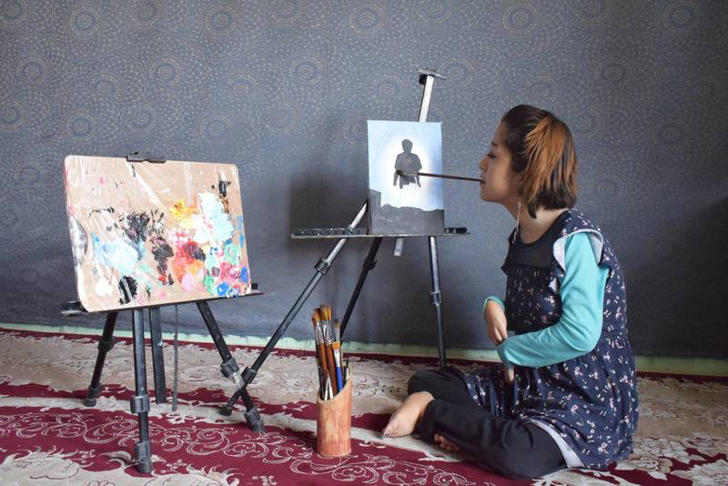 Robaba Mohammadi uses her mouth to produce oil paintings. Robaba Mohammadi