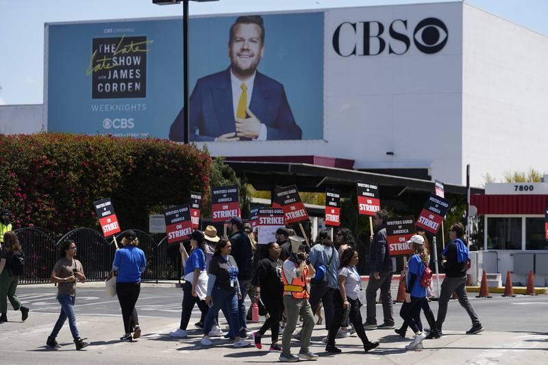 For the first time in 15 years, Hollywood’s film and TV writers have walked out on strike. Pictured: Members of the Writers Guild of America outside the CBS Television City in the Fairfax District of Los Angeles. AP Photo