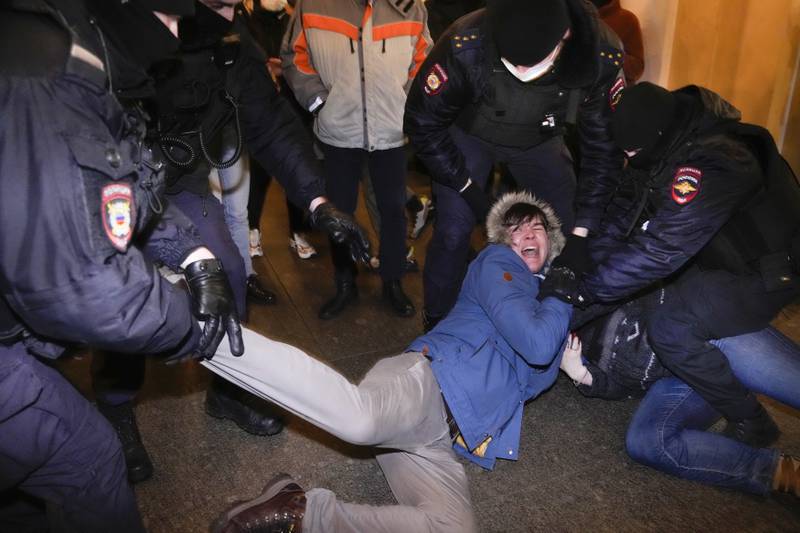 Police officers detain demonstrators in St. Petersburg, Russia. Hundreds of people gathered in Moscow and St.  Petersburg on Thursday, protesting against Russia's attack on Ukraine.  Similar protests took place in other Russian cities, and activists were also arrested. AP Photo