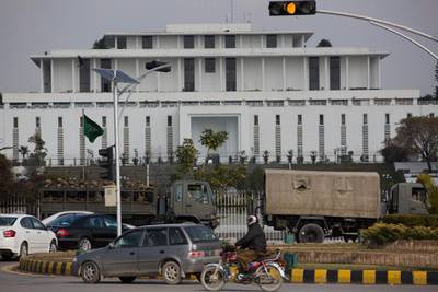 Pakistan Army trucks park outside a presidential palace as security is increased in Islamabad. AP Photo