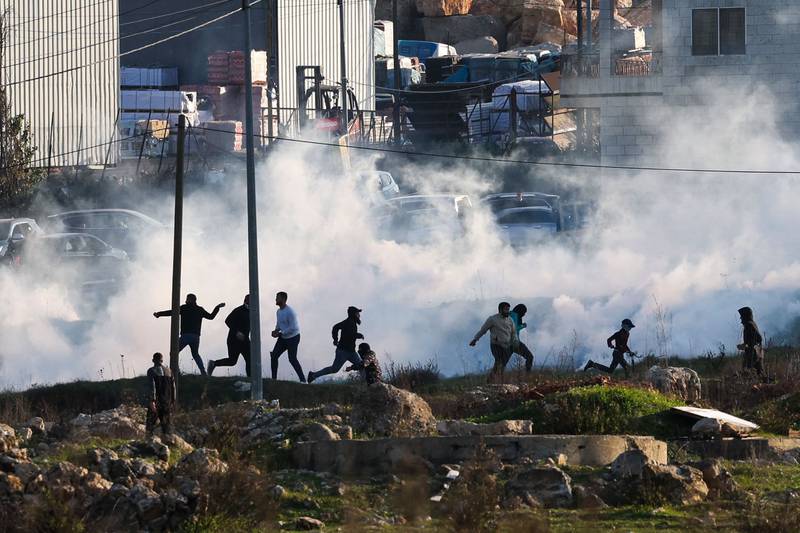 Israeli forces fire tear gas to disperse demonstrators near Beit El in the occupied West Bank. AFP