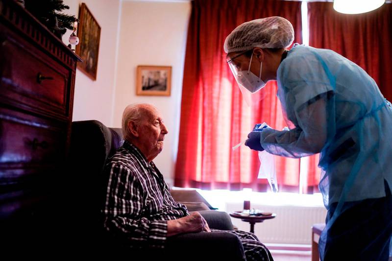A nurse arrives to test a resident of the Christalain home for the elderly in Brussels, Belgium. AFP