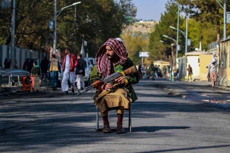 A Taliban guard outside a military hospital in Kabul, a day after a deadly attack by ISIS militants. EPA