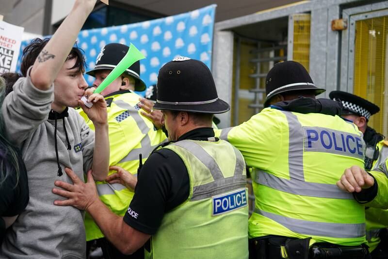 Protesters and police clash in Birmingham city centre. Getty Images 