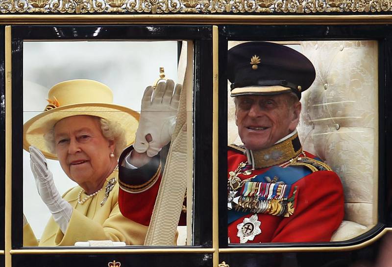 LONDON, ENGLAND - APRIL 29:  Queen Elizabeth II Prince Philip, Duke of Edinburgh ride in a carriage procession to Buckingham Palace following the marriage of Their Royal Highnesses Prince William Duke of Cambridge and Catherine Duchess of Cambridge at Westminster Abbey on April 29, 2011 in London, England. The marriage of the second in line to the British throne was led by the Archbishop of Canterbury and was attended by 1900 guests, including foreign Royal family members and heads of state. Thousands of well-wishers from around the world have also flocked to London to witness the spectacle and pageantry of the Royal Wedding.  (Photo by Paul Gilham/Getty Images)