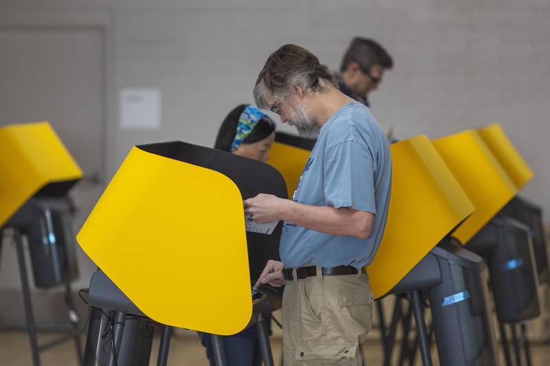 Voters cast their ballots at a voting center at Granada Park in Alhambra, California. AFP