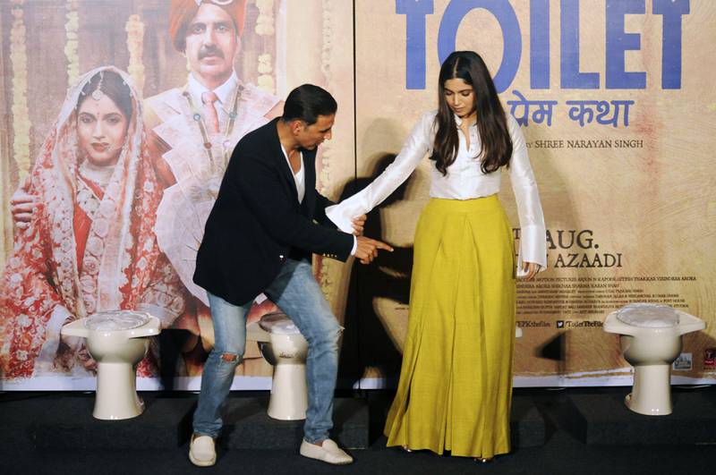 (FILES) This file photo taken on July 27, 2017 shows Indian Bollywood actors Akshay Kumar (L) and Bhumi Pednekar attending a press conference for the Hindi film "Toilet: Ek Prem Katha" in Mumbai.
Bollywood may be famous for its blingy song and dance numbers, but a new movie released on August 11 deals with a distinctly less glamorous subject -- India's chronic lack of toilets. "Toilet: Ek Prem Katha" ("Toilet: A love story") is inspired by the true-life tale of one man's battle to build toilets in his village in rural India. / AFP PHOTO / STR / TO GO WITH 'INDIA-ENTERTAINMENT-HEALTH' BY UDITA JHUNJHUNWALA