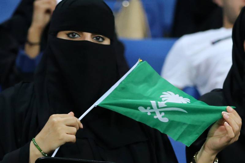 A Saudi Arabian waves a flag. EPA