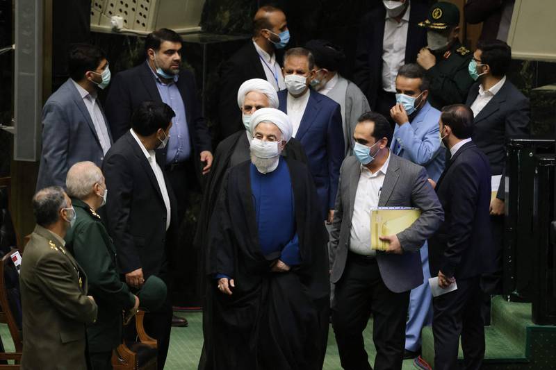 Iran's outgoing president, Hassan Rouhani (centre), arrives at the swearing in ceremony for Iran's new president at the parliament in the Islamic republic's capital Tehran.
