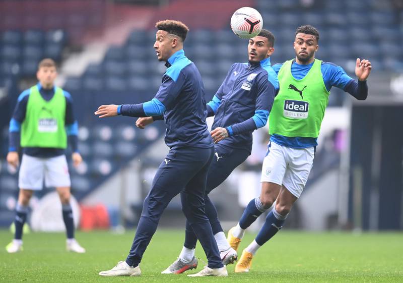 WEST BROMWICH, ENGLAND - NOVEMBER 08: (L-R) Callum Robinson, Karlan Grant and Lee Peltier of West Bromwich Albion warm up ahead of the Premier League match between West Bromwich Albion and Tottenham Hotspur at The Hawthorns on November 08, 2020 in West Bromwich, England. Sporting stadiums around the UK remain under strict restrictions due to the Coronavirus Pandemic as Government social distancing laws prohibit fans inside venues resulting in games being played behind closed doors. (Photo by Laurence Griffiths/Getty Images)