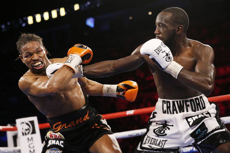 Terence Crawford hits Shawn Porter during a welterweight title boxing match. AP Photo