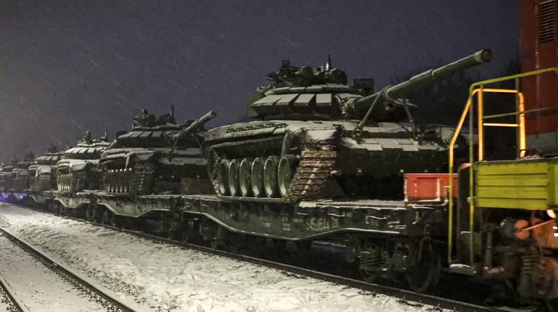 Russian army tanks are loaded on to railway platforms to move back to their permanent base after drills in Russia. AP Photo