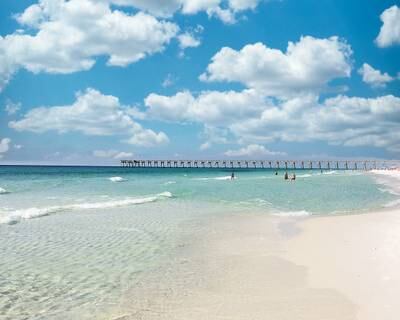 5. View of Pensacola Beach with the fishing pier in the far distance in Florida, US.