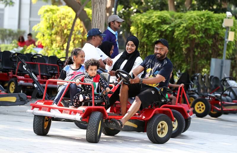 Taking some transport to get around Zabeel Park on National Day. Pawan Singh / The National
