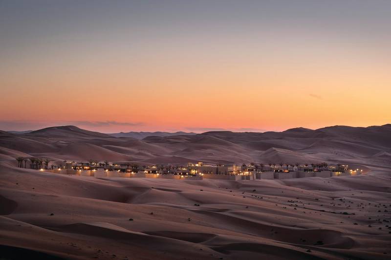 Qasr Al Sarab Desert Resort by Anantara at dusk
