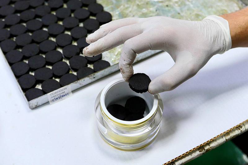 SHARJAH, UNITED ARAB EMIRATES , April 14  – 2021 :- Workers packing the Bakhoor tablets at the Swiss Arabian perfume and Bakhoor factory in Sharjah. ( Pawan Singh / The National ) For News/Online/Instagram. Story by Kelly