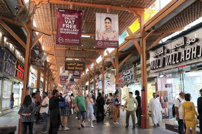 DUBAI , UNITED ARAB EMIRATES , Mar 10 – 2020 :- Tourists at the Dubai Gold Souk in Deira Dubai. ( Pawan Singh / The National ) For News/Online. Then and Now series