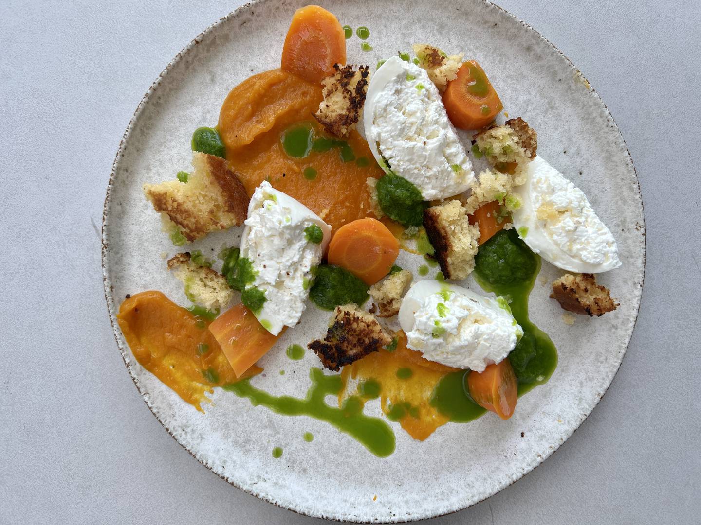 A carrot and burrata dish, made using carrot peel and carrot top greens, by chef Kelvin Leung.