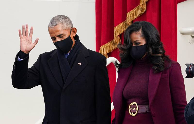 Former US president Barack Obama and his wife Michelle Obama arrive for the inauguration of Joe Biden on the West Front of the US Capitol. Reuters