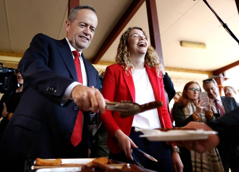 Labor Leader Bill Shorten and Labor candidate for Boothby Nadia Clancy hand out sausages to supporters during a community BBQ in Adelaide, Australia. Getty Images