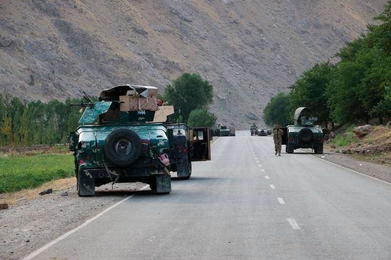 Afghan soldiers pause on a road at the front line of fighting between the Taliban and security forces, near the northern city of Badakhshan, on Sunday. AP
