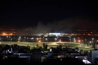 Smoke rises over Erbil, Iraq, after an attack near the city's airport in February. Image: Reuters