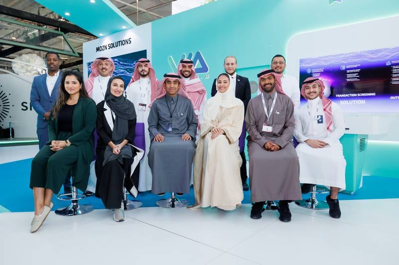 Mohammed Alhussein, founder and chief executive of Mozn, seated, third from left, with team members at the Leap technology conference in Riyadh, in February. Photo: Mozn