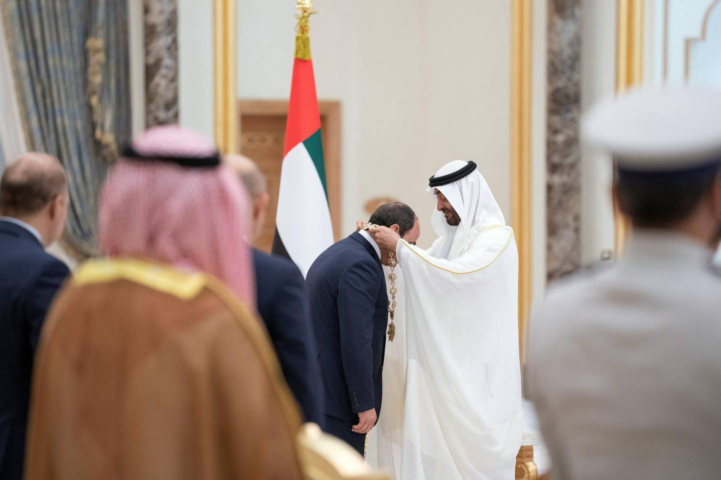 ABU DHABI, UNITED ARAB EMIRATES - November 14, 2019: HH Sheikh Mohamed bin Zayed Al Nahyan, Crown Prince of Abu Dhabi and Deputy Supreme Commander of the UAE Armed Forces (R), confers the Order of Zayed medal to HE Abdel Fattah El Sisi, President of Egypt (L), during a state visit reception at Qasr Al Watan.

( Hamad Al Mansoori for the Ministry of Presidential Affairs )

---