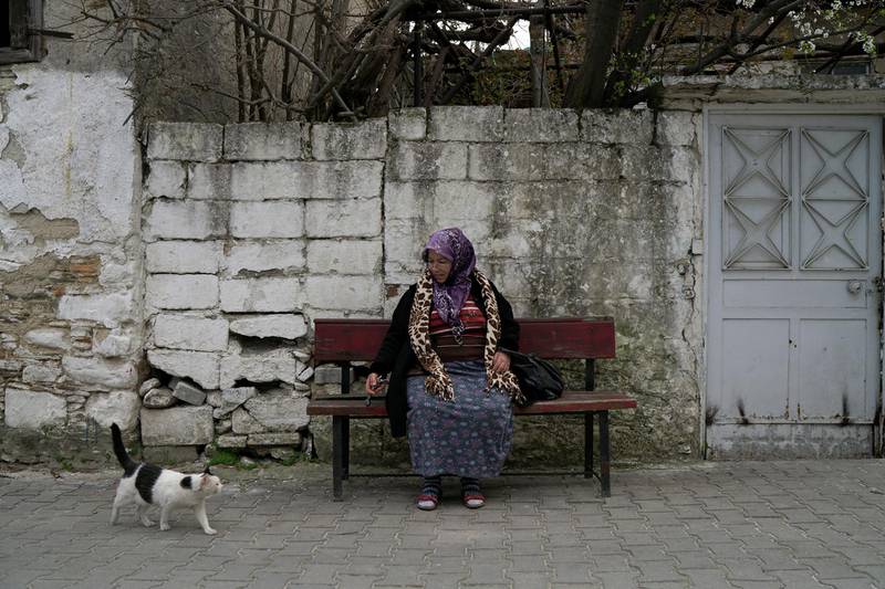 Tayyibe Demirel rests on the roadside in Turgut village, near Yatagan, in Mugla province, Turkey. She fears a coal mine will end up surrounding her six-acre olive grove. Reuters