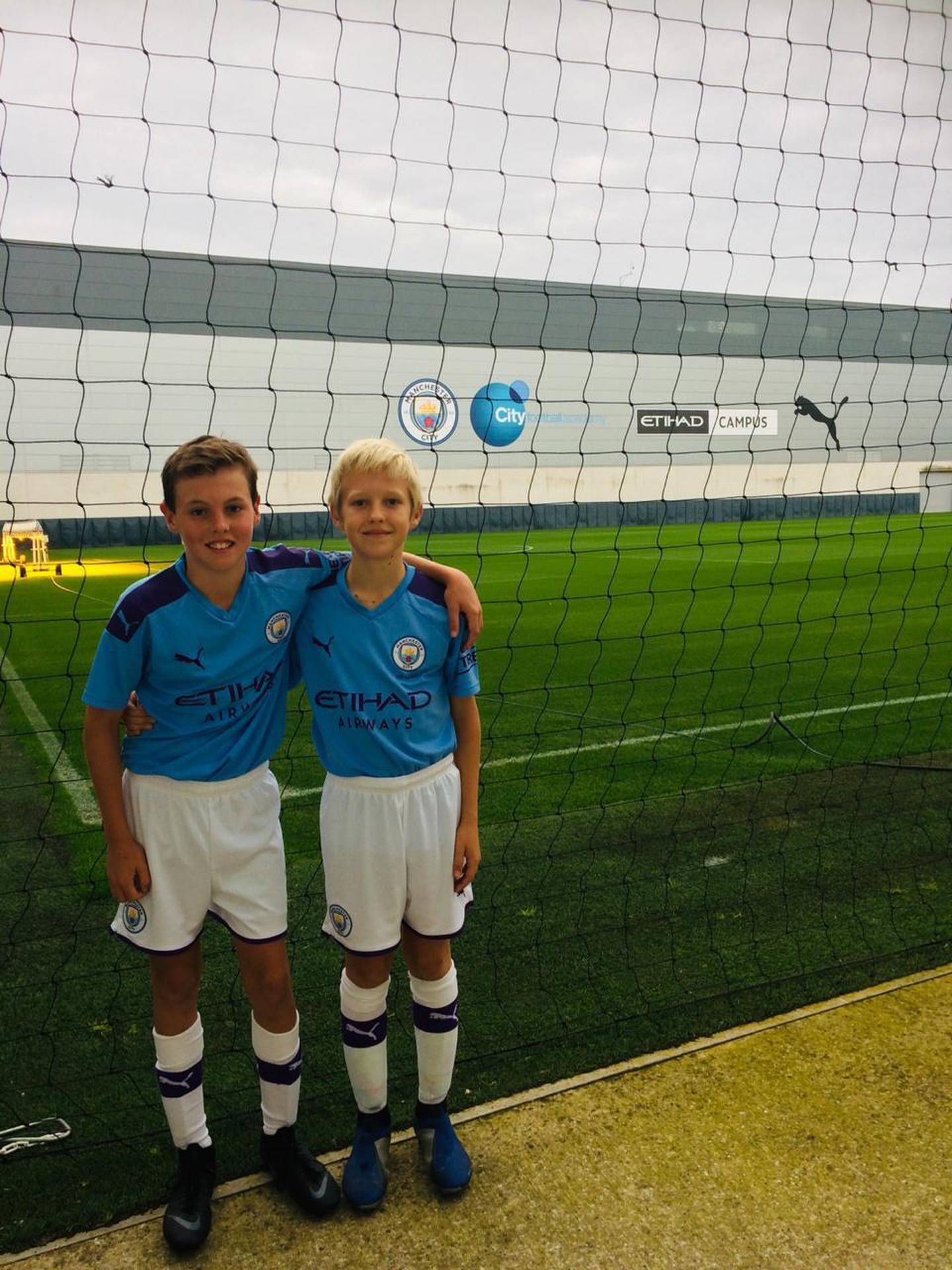Thomas Nesbitt and Robert March receiving coaching at the top class facilities provided by Premier League winners, Manchester City. Courtesy City Football Schools