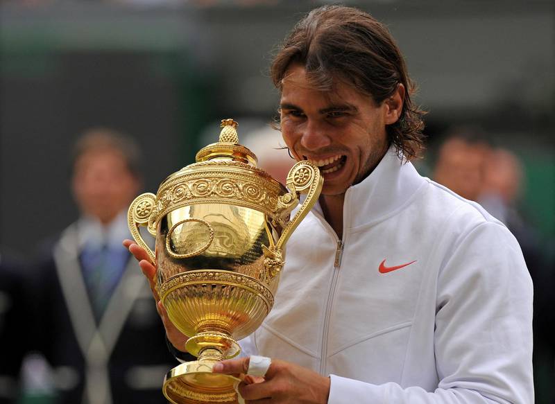 Spain's Rafael Nadal holds the Wimbledon Trophy after beating Czech Republic's Tomas Berdych 6-3, 7-5, 6-4, in the Men's Singles Final at the Wimbledon Tennis Championships at the All England Tennis Club, in south-west London, on July 4, 2010. AFP PHOTO/ADRIAN DENNIS (Photo by ADRIAN DENNIS / AFP)