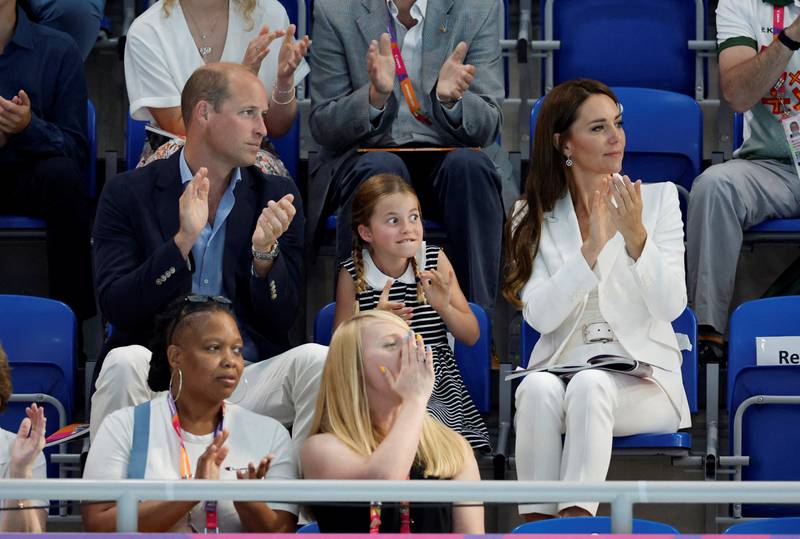 Princess Charlotte watches the Commonwealth Games' swimming competition with her parents, Prince William and Catherine, Duchess of Cambridge, in Birmingham. Reuters