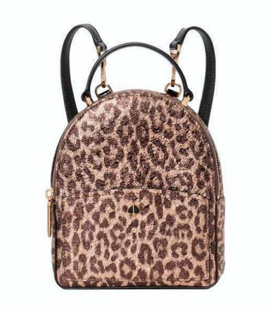Don't want to carry a handbag? Try a backpack and keep your hands free. This leopard print version by Kate Spade is a good size.