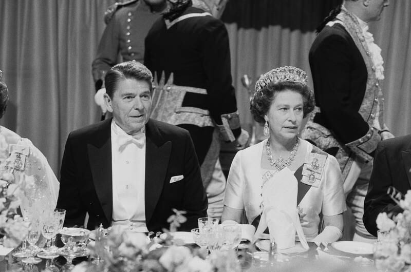 Ronald Reagan, US president at the time, and the queen attend a gala dinner at Windsor Castle in 1982. Getty